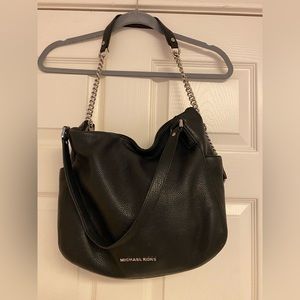 Micheal Kors,excellent condition,multi pockets inside.black bag.Strap&Handles